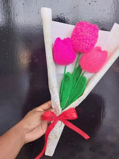 A beautiful bouquet of three bright pink crochet tulips. Tulips are one of my favorite flowers to make, and they look so elegant in any setting.