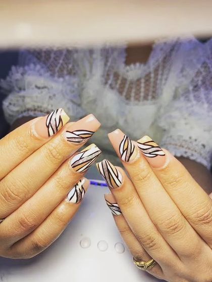 A graphic, abstract line-work design in black, white, and nude on square-shaped nails.