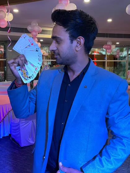 A photo from a recent birthday party show, ready to amaze the guests with some card magic.
