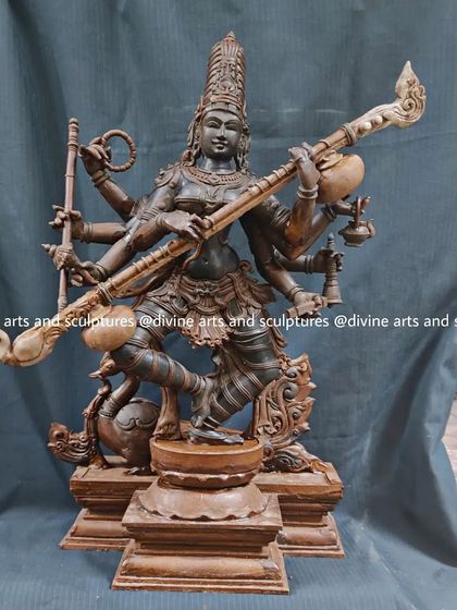 The wax model of Saraswati, the goddess of knowledge and arts. Her form, complete with her veena and other attributes, is elegantly captured in this pre-casting stage.