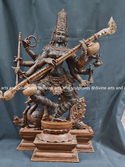 The wax model of Saraswati, the goddess of knowledge and arts. Her form, complete with her veena and other attributes, is elegantly captured in this pre-casting stage.