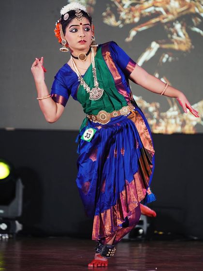 A dynamic shot of a student in the open category, capturing her mid-movement. Her performance earned her a 2nd place award.