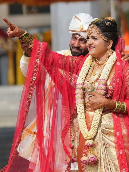 A candid shot of the bride and groom, full of joy. The makeup is designed to be sweat-proof and long-lasting, ensuring the bride looks fresh throughout the day's events.