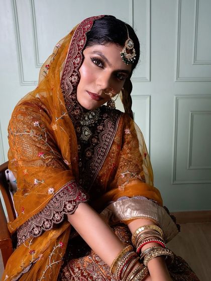 A powerful and traditional bridal look created by one of our students. The bold eyes and rich colors are perfectly balanced, demonstrating a strong understanding of classic bridal artistry.