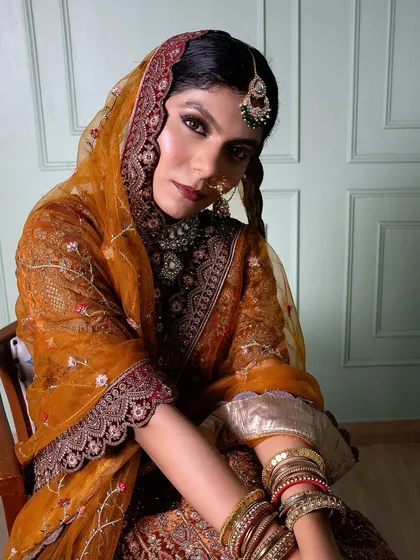 A powerful and traditional bridal look created by one of our students. The bold eyes and rich colors are perfectly balanced, demonstrating a strong understanding of classic bridal artistry.