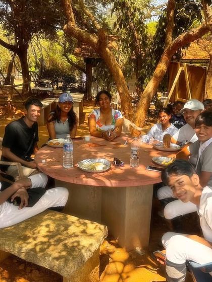 My team enjoying a well-deserved meal together during the Auroville Horse Show. These moments of relaxation and bonding are crucial for team morale.