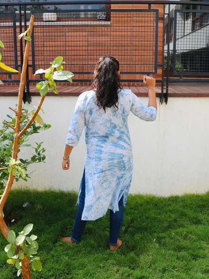 Another shot of the indigo shrug from the back. It's a comfortable and stylish layering piece for any season.