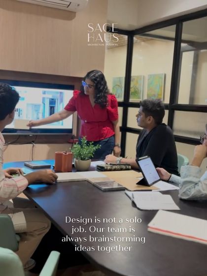 Design is not a solo job. This photo shows our team brainstorming ideas together, pointing at a screen and collaborating to ensure every project benefits from our collective creativity and expertise.