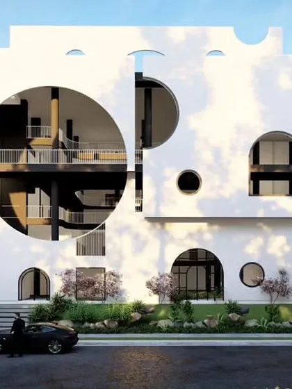A concept design for a preschool featuring a playful facade with varied circular and arched openings. The non-imposing scale is intentionally designed to create a welcoming environment that eases the transition from home to school for young children.
