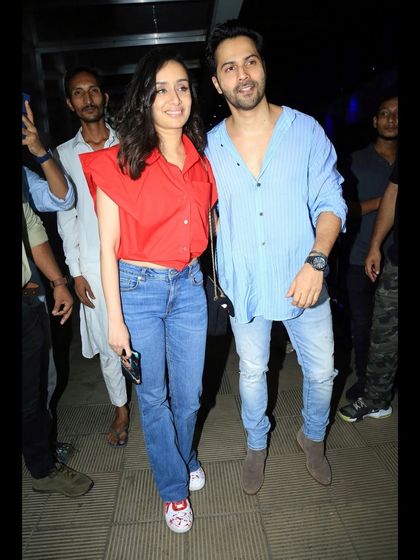Another shot of Shraddha Kapoor and Varun Dhawan, showing how the custom sneakers complete her casual look.