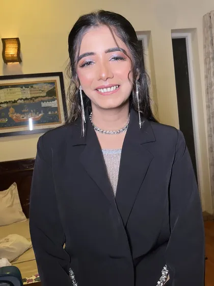 Alisha's smile shows how confident and beautiful she felt in this modern cocktail attire. The makeup was designed to be long-lasting and photo-ready.
