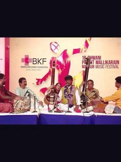 A video still from the performance with Pandit Jayateerth Mevundi sir, showing the full group of musicians on stage.