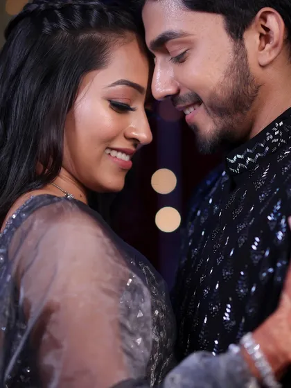 An intimate moment between the couple. This profile view shows the beautiful contouring and highlight that defines her features for the Sangeet night.