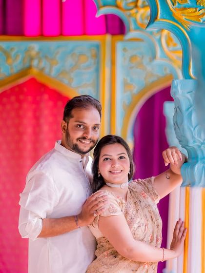 A playful moment for a couple in our colorful Jaipuri palace set.
