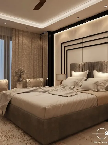 A serene bedroom with a neutral color scheme. The custom upholstered bed and headboard, paired with soft lighting and elegant chairs, create a peaceful atmosphere perfect for rest.
