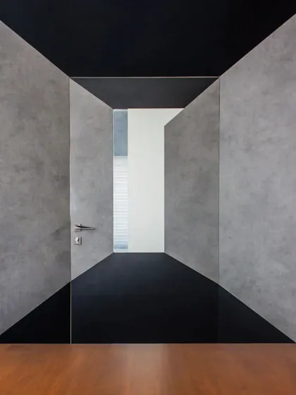 This is from a minimalist workspace I designed, called 'Acutely Bare'. The design uses strong geometric forms and a restrained palette of concrete and wood to create a focused, uncluttered, and inspiring office environment.