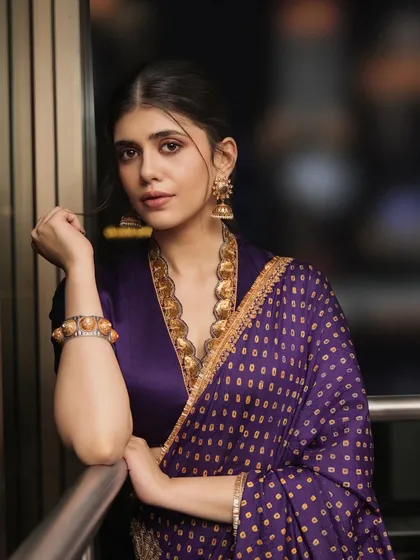The lovely Sanjana Sanghi elevates her look with our statement temple coin necklace and matching jhumkas, a perfect pairing for her deep purple saree.