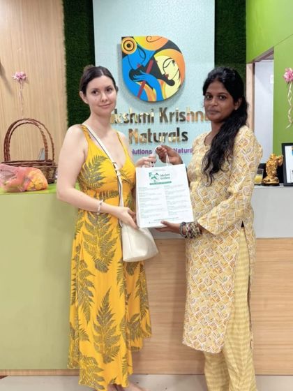 An international customer receives her purchase from one of our team members at the counter. It is always a pleasure to serve a global community that trusts in our natural, made-in-India products.