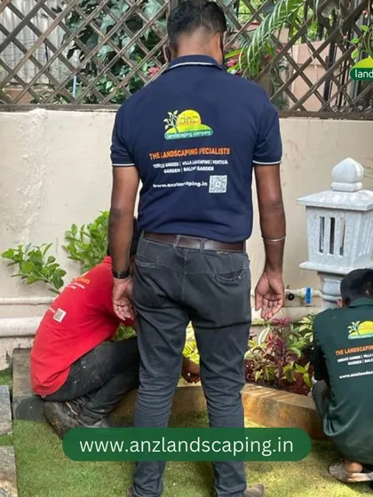 Our team meticulously works on the planting beds, placing each plant according to the design plan under the guidance of a senior landscaper.
