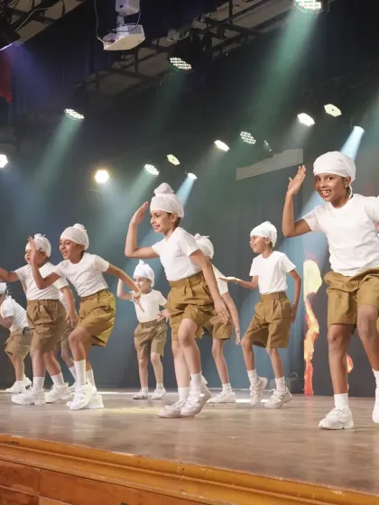 Our young students performing a high-energy Bhangra-inspired routine. We introduce kids to various dance styles, including energetic Indian folk dances.