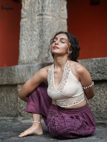 A moment of serene meditation, embodying the belief that our bodies possess a deep intuition. When we listen, they guide us back to our true selves.