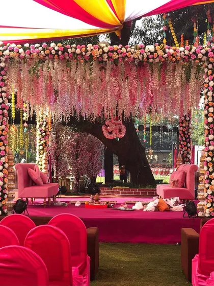 A closer look at a beautiful floral vidhi mandap, rich with tradition and meaning. We used cascading wisteria and dense floral pillars to create an intimate and sacred setting for the wedding pheras in Lonavala.