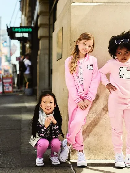 A group shot on 7th Avenue. Posing three kids together and getting a great shot requires patience and quick thinking. It's about finding that split second where they all look great and their personalities come through.