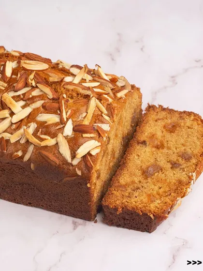 This is our almond and fruit travel cake. It's a moist loaf studded with dried fruits and topped with sliced almonds for a wonderful texture.