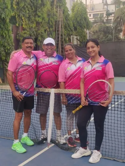 A team photo of four Mixed Doubles participants in their matching event jerseys.