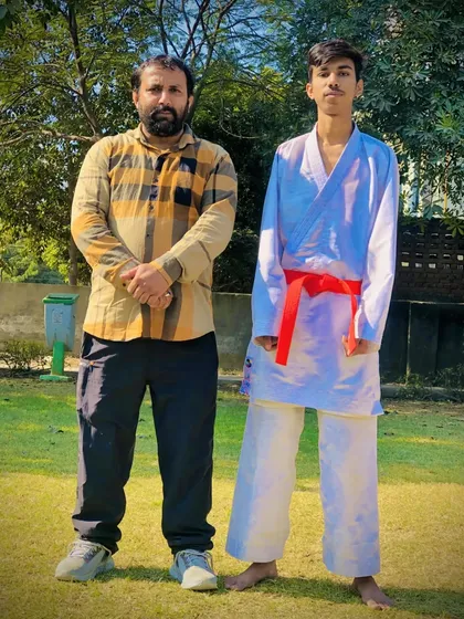 A senior student after successfully completing his red belt test. He is now one step closer to the coveted black belt.