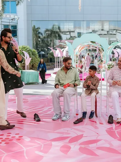 Hosting a Sindhi wedding carnival is always a magical experience. Here I am organizing a game of musical chairs, a classic that never fails to entertain.