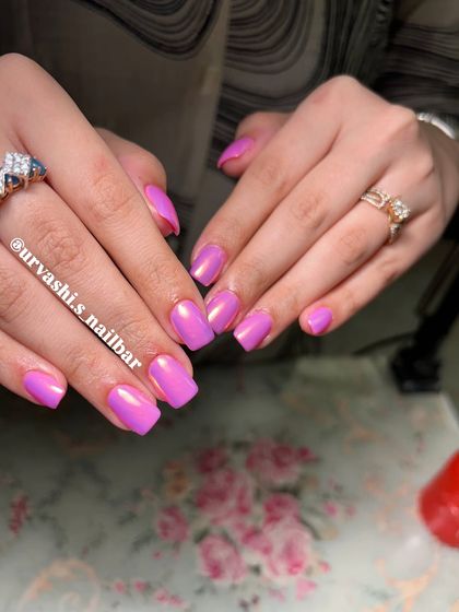 This is the ultimate Barbie look. A vibrant, glossy pink with a chrome finish that gives it an iridescent shine, perfect for anyone who loves a bold and feminine style.