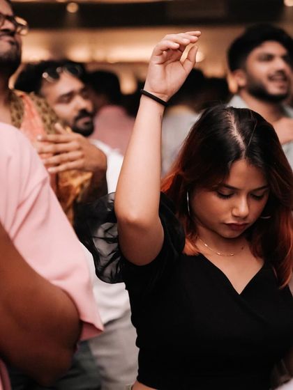 A candid of someone lost in the rhythm of the music.