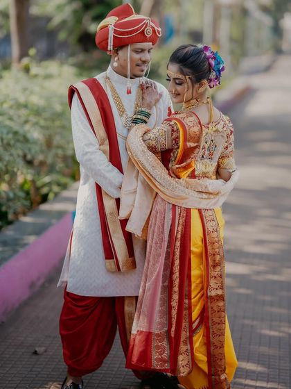 An intimate portrait capturing the bride adjusting her groom's attire. It's these small, unscripted acts of care that truly define a couple's bond on their wedding day.