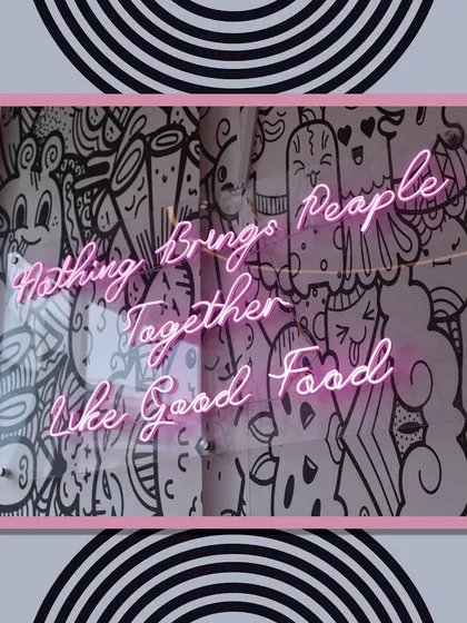 "Nothing brings people together like good food." This neon sign at our venue reflects our philosophy. We believe that great food is a key ingredient for a memorable party.