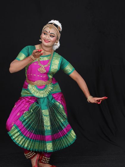 Being a teacher involves many skills, including costume selection. Here, we had to alter the fan for Aditi Elan's costume to ensure it didn't look too gaudy.