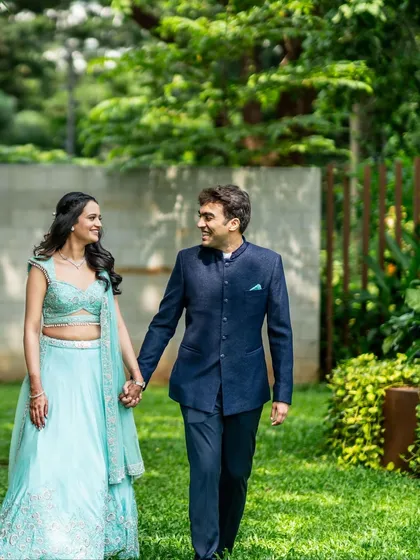 A candid moment of Sonal and Paul walking hand-in-hand through a garden. These natural shots are perfect for capturing genuine connection.