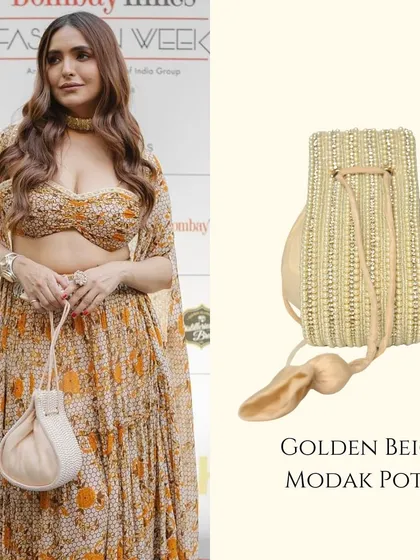 The Modak Potli is one of my most loved designs, seen here at Bombay Times Fashion Week. Its unique shape and delicate golden beige beadwork make it a sophisticated choice for any festive ensemble.