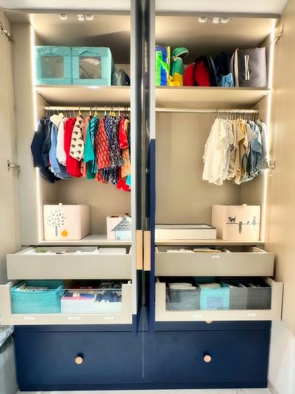 A look at a beautifully organized kid's wardrobe. We use bins, kid-friendly hangers, and accessible drawers to create a system that children can learn to maintain themselves.