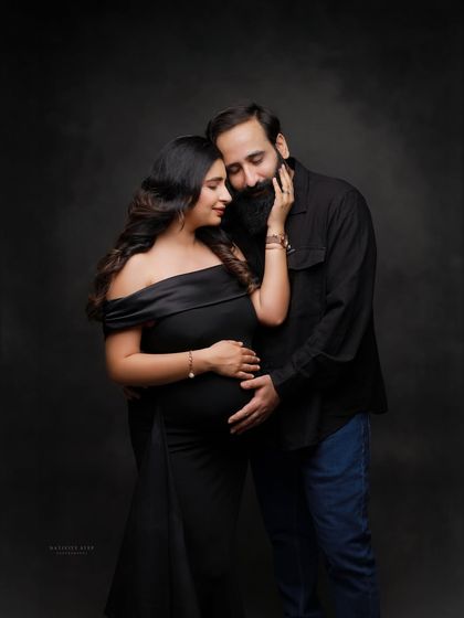 An intimate close-up of the couple. The husband's gentle touch and their close embrace convey a deep sense of connection and love.