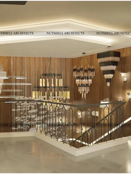 The interior of a high-end lighting store we designed. The space serves as a gallery, with a dramatic central staircase and wood-paneled walls providing a rich backdrop to display a wide variety of sculptural and modern chandeliers.
