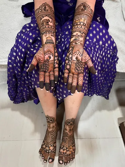 The complete bridal look, with coordinated designs for the hands and feet. The intricate patterns create a stunning effect from head to toe.