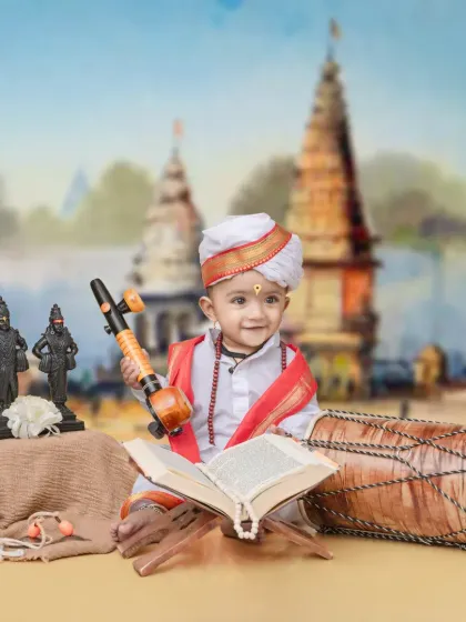 I honor our local Varkari heritage with this special theme. Your child will be dressed in traditional white robes, holding a veena, with a backdrop of Pandharpur, creating a timeless memory of devotion.
