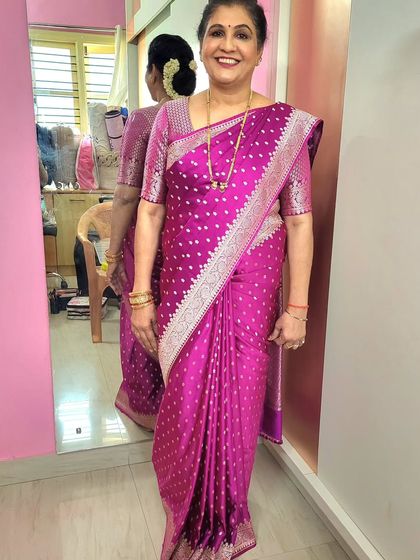 A lovely Banarasi saree draping for a client's birthday celebration. The pleats are kept 'fluffy' and neat for a classic and celebratory look.