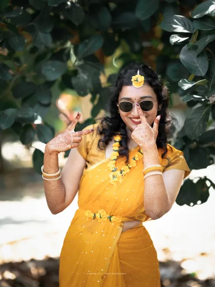 The bride shows off her playful side during her Haldi shoot. We believe in capturing personalities, not just poses.