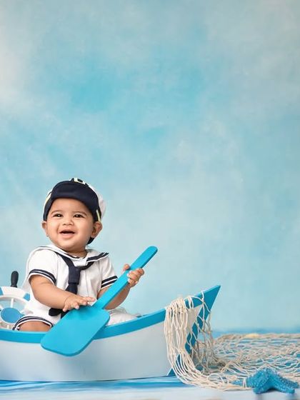 A happy sailor enjoying the sunshine on the water. The bright lighting and cheerful expression make this a standout shot from my nautical collection.