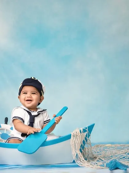 A happy sailor enjoying the sunshine on the water. The bright lighting and cheerful expression make this a standout shot from my nautical collection.