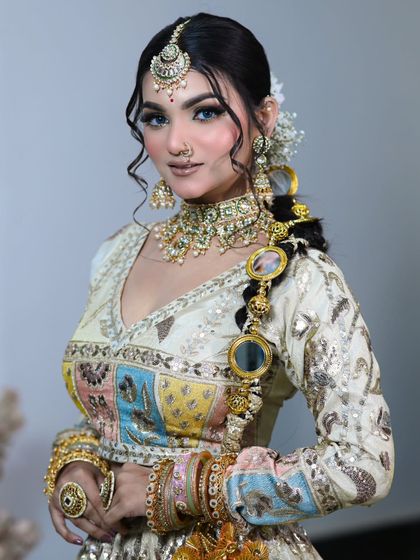 Another angle of this elegant nude bridal look. The focus is on flawless skin and a soft, romantic feel.