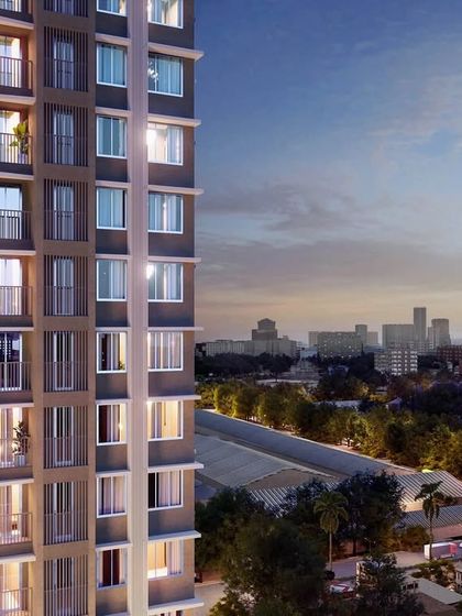 A close-up render of a residential tower in North Mumbai. The focus is on the building's façade and its relationship with the surrounding greenery, illustrating our goal of providing unobstructed views and a connection to the landscape.