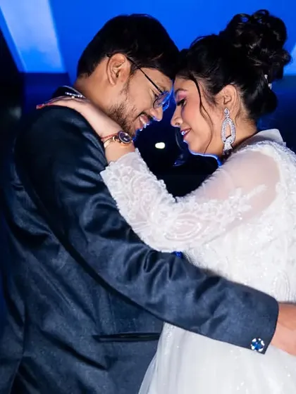 A stylish, cinematic shot from a Catholic wedding reception. We use creative lighting and composition to add a touch of modern artistry to your wedding album, telling your story with elegance.